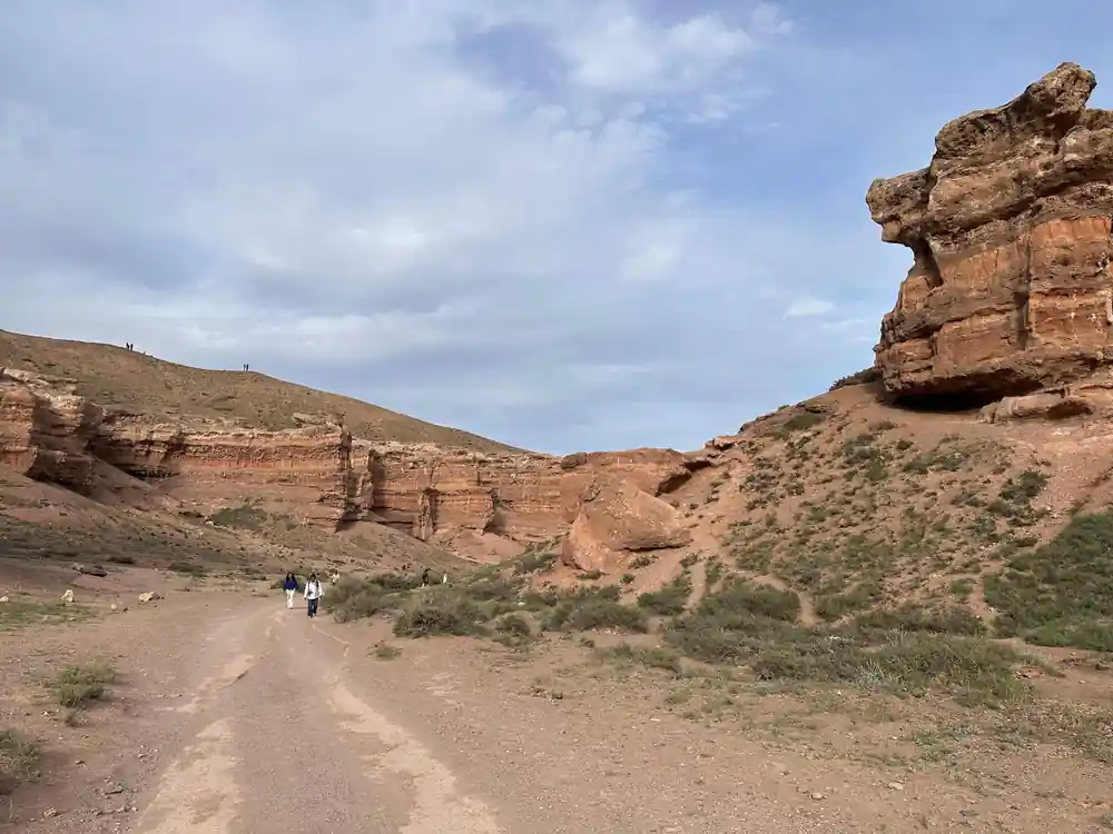 Dirt road through rocky desert canyon landscape