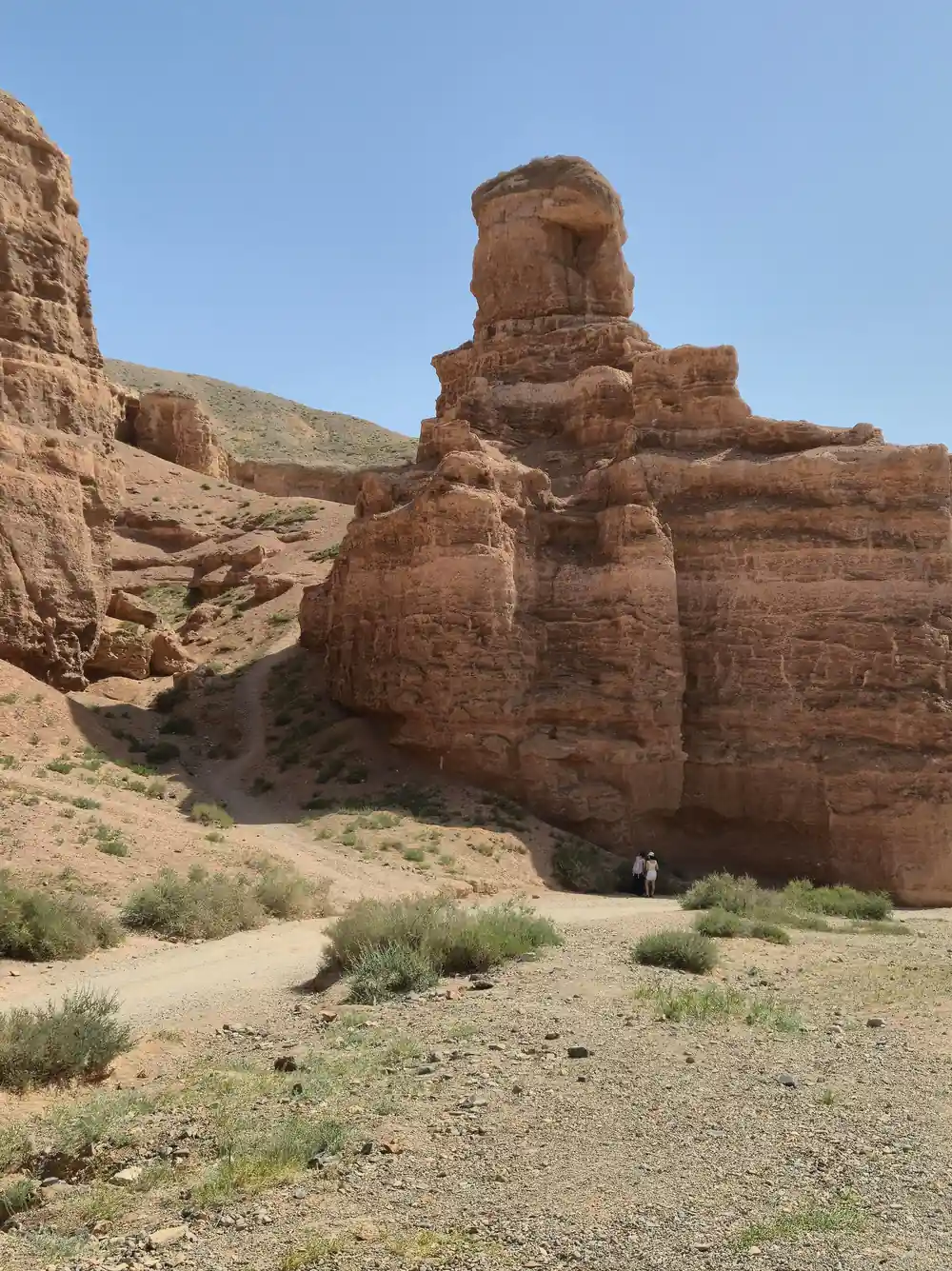 Distinctive rock formation shaped like figure in desert