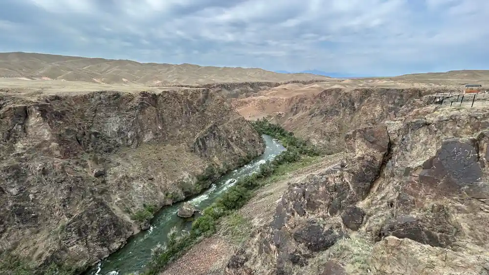 River flowing through deep rocky canyon with arid hills